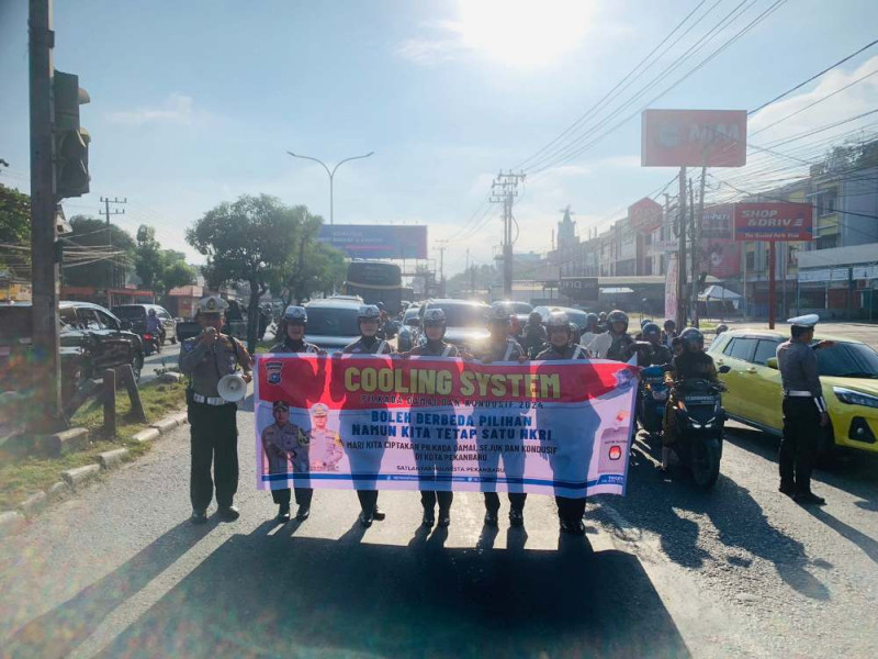 Turun ke Jalan, Satlantas Polresta Pekanbaru Sosialiasi Pilkada Damai dan Tertib Berlalu Lintas